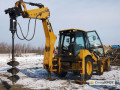 Фото Аренда ямобура на базе экскаватора-погрузчика Caterpillar