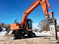 Фото Колесный экскаватор с гидромолотом Doosan DX190W в аренду